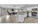 Open-concept living space with modern kitchen, dining, and living room at 5433 Escallonia St, Las Vegas, NV 89149