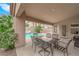 Gorgeous covered patio overlooking a sparkling pool and lush landscaping at 5433 Escallonia St, Las Vegas, NV 89149
