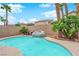 Great backyard with rock waterfall feature flowing into the sparkling pool at 5433 Escallonia St, Las Vegas, NV 89149