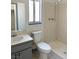 Simple bathroom featuring a vanity sink and a walk-in shower with neutral tiling at 5436 Burkshire Dr, Las Vegas, NV 89142