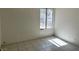 Modest bedroom with tile flooring and a bright window at 5436 Burkshire Dr, Las Vegas, NV 89142