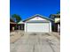 Charming single-story home with a large two-car garage, clear blue skies, and easy parking at 5436 Burkshire Dr, Las Vegas, NV 89142