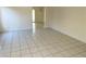 Bright living room with clean tile flooring, neutral walls, and an open layout at 5436 Burkshire Dr, Las Vegas, NV 89142