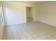 Bright living room with clean tile flooring, neutral walls, and an open layout at 5436 Burkshire Dr, Las Vegas, NV 89142