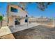 A spacious backyard with a covered patio area, perfect for outdoor entertaining and relaxation at 5466 Silverheart Ave, Las Vegas, NV 89142