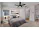 Main bedroom with ceiling fan, neutral decor, and ensuite bathroom at 5466 Silverheart Ave, Las Vegas, NV 89142