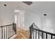 Upstairs hallway with modern lighting and black metal railings at 5466 Silverheart Ave, Las Vegas, NV 89142