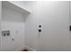 Laundry room with a shelf, hookups, and a door, perfect for keeping things organized at 5466 Silverheart Ave, Las Vegas, NV 89142