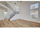 Modern living room with high ceilings, large windows, and staircase at 5466 Silverheart Ave, Las Vegas, NV 89142