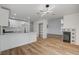 Open living space with a modern kitchen, fireplace, and sleek flooring, ideal for a comfortable lifestyle and entertaining at 5466 Silverheart Ave, Las Vegas, NV 89142