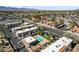 Wide aerial shot of the apartment complex with a pool, parking, and surrounding neighborhood at 5939 Vegas Dr, Las Vegas, NV 89108