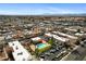 Aerial view of a residential area featuring an apartment complex with a pool and surrounding homes at 5939 Vegas Dr, Las Vegas, NV 89108