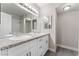 Bathroom featuring double sinks, granite counters, and a large mirror with ample lighting at 5939 Vegas Dr, Las Vegas, NV 89108