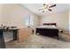 Carpeted bedroom with dark wood accents, features a window and ceiling fan at 5939 Vegas Dr, Las Vegas, NV 89108