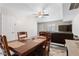 Dining area features a ceiling fan, a wood table with seating and new floors at 5939 Vegas Dr, Las Vegas, NV 89108