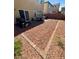 Backyard with grill, patio furniture and pet dog enjoying the view at 6142 Kelson Creek Ct, Las Vegas, NV 89118