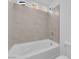 Close-up of a tiled shower-tub combination, complemented by modern fixtures and bright lighting at 6142 Kelson Creek Ct, Las Vegas, NV 89118