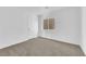 Bright bedroom filled with natural light, a window, and new neutral carpeting at 6142 Kelson Creek Ct, Las Vegas, NV 89118