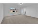 Bedroom with neutral carpet and a large window for natural light at 6142 Kelson Creek Ct, Las Vegas, NV 89118