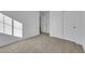 A cozy room features neutral carpet flooring, great natural light, and ample storage space at 6142 Kelson Creek Ct, Las Vegas, NV 89118