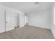 Bright, carpeted bedroom with white walls, closet, and door leading to other rooms at 6142 Kelson Creek Ct, Las Vegas, NV 89118