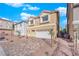 Inviting two-story home featuring a two-car garage and desert landscaping in front at 6142 Kelson Creek Ct, Las Vegas, NV 89118