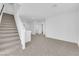 Hallway with neutral carpet and natural light, complementing the staircase design and neutral color scheme at 6142 Kelson Creek Ct, Las Vegas, NV 89118