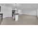 Kitchen features large island with granite countertops, tile floor, and stainless appliances at 6142 Kelson Creek Ct, Las Vegas, NV 89118