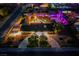 Night aerial view showcasing pool, sport court and a large lot with landscape lighting at 6419 Eldora Ave, Las Vegas, NV 89146