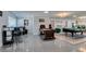 Basement game room with a full bar, billiards area, comfortable seating and tile floors at 6419 Eldora Ave, Las Vegas, NV 89146