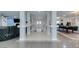 Finished basement with multiple entertainment areas, white pillars, and a full-length view at 6419 Eldora Ave, Las Vegas, NV 89146