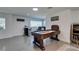 Finished basement featuring a bar, game table, and comfortable seating area at 6419 Eldora Ave, Las Vegas, NV 89146