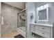 Bathroom featuring a shower-tub combo with decorative tile, a modern vanity, and neutral-toned walls at 6419 Eldora Ave, Las Vegas, NV 89146