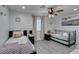 Charming bedroom with two twin beds, ceiling fan and neutral-toned walls and artwork at 6419 Eldora Ave, Las Vegas, NV 89146