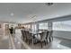 Elegant dining room with a long table, seating for ten, and contemporary light fixture at 6419 Eldora Ave, Las Vegas, NV 89146