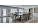 Bright dining room with a long table, seating for twelve, with natural light at 6419 Eldora Ave, Las Vegas, NV 89146