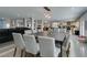 Dining room with seating for twelve, modern decor, and views of other common spaces at 6419 Eldora Ave, Las Vegas, NV 89146
