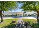Charming single-story home with lush front yard landscaping and circular driveway at 6419 Eldora Ave, Las Vegas, NV 89146