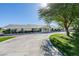 Inviting single story house featuring a long circular driveway with a well-manicured lawn at 6419 Eldora Ave, Las Vegas, NV 89146