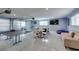 Spacious game room with ping pong table, plush sofa, and multiple seating options for ultimate entertainment at 6419 Eldora Ave, Las Vegas, NV 89146