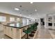 Open kitchen featuring a large island with seating and pendant lighting fixtures at 6419 Eldora Ave, Las Vegas, NV 89146