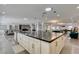 Large kitchen island with a sink offers seating and prep space in an open layout at 6419 Eldora Ave, Las Vegas, NV 89146