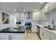Bright kitchen featuring stainless appliances, white cabinets, and modern countertops at 6419 Eldora Ave, Las Vegas, NV 89146