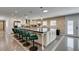Bright open kitchen featuring a large center island with seating and modern appliances at 6419 Eldora Ave, Las Vegas, NV 89146