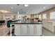 Spacious open kitchen with a large island, pendant lights, and sleek countertops at 6419 Eldora Ave, Las Vegas, NV 89146