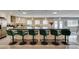 Kitchen island with barstool seating, pendant lights, and tile flooring at 6419 Eldora Ave, Las Vegas, NV 89146