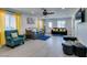 Bright living room with gray floors, modern decor, and plenty of seating at 6419 Eldora Ave, Las Vegas, NV 89146