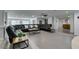 Open concept living room with hexagon tile flooring, recessed lights, and large leather sofa at 6419 Eldora Ave, Las Vegas, NV 89146