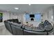 Wide living room with a fireplace, recessed lighting, modern ceiling fan, and oversized sofa at 6419 Eldora Ave, Las Vegas, NV 89146