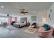 Comfortable and expansive main bedroom featuring sitting area, ceiling fan, and soft pink accents at 6419 Eldora Ave, Las Vegas, NV 89146